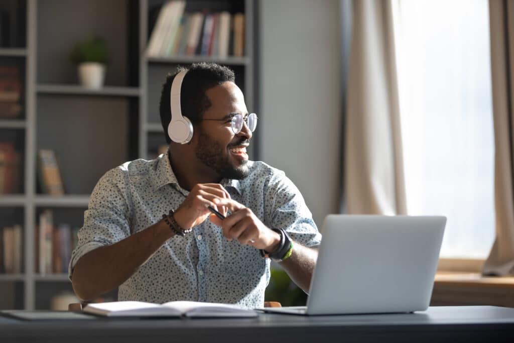 Happy,Relaxed,Millennial,Afro,American,Business,Man,Wear,Wireless,Headphones