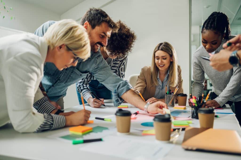 Diverse,Employees,Gathered,In,The,Office,Having,Fun,During,Brainstorming